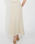 Pointelle knit vest top and maxi pleated skirt in beige