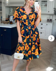 Oversized puff sleeve midi dress in Multi color floral print