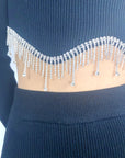 Scalloped shape knit top with diamonded chain embellish and midi skirt co-ords in black