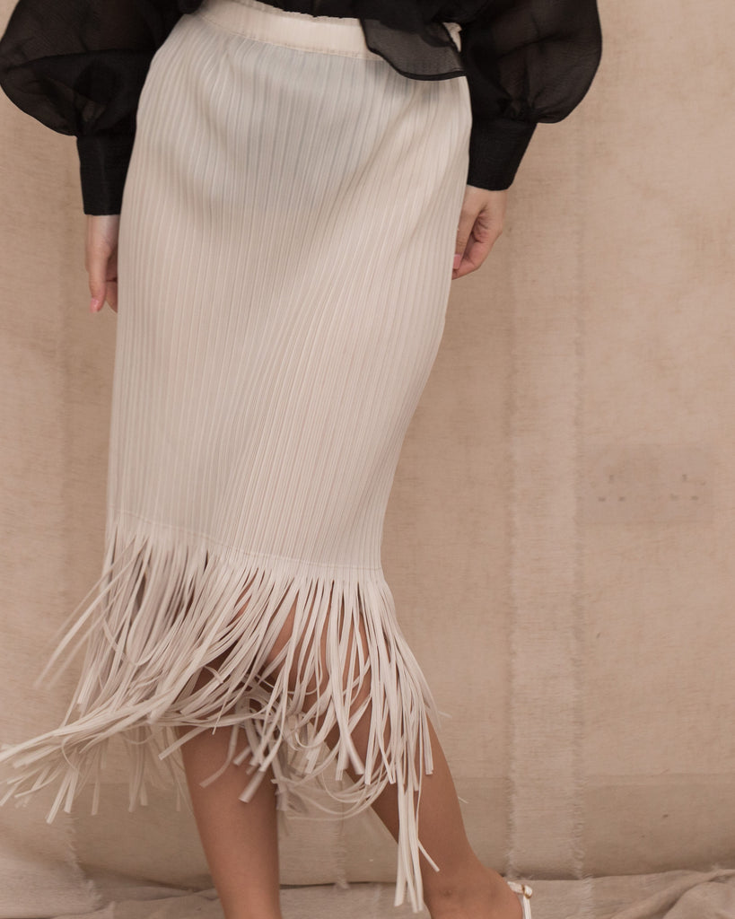 Pleated Midi Skirt with multi fringed tassel hem design in white