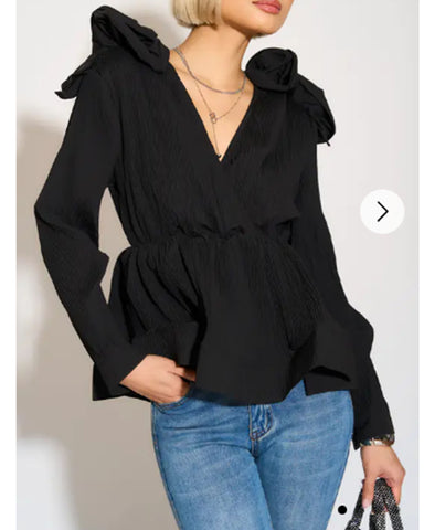 Pleated shirt with ruffle hem and floral design on shoulder in black
