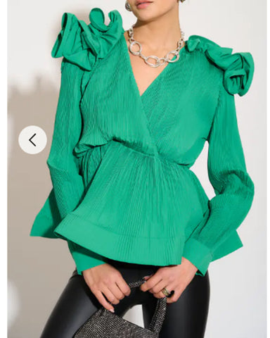 Pleated shirt with ruffle hem and floral design on shoulder in green