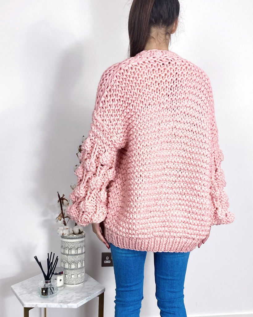Hand knit cable design cardigan in pink