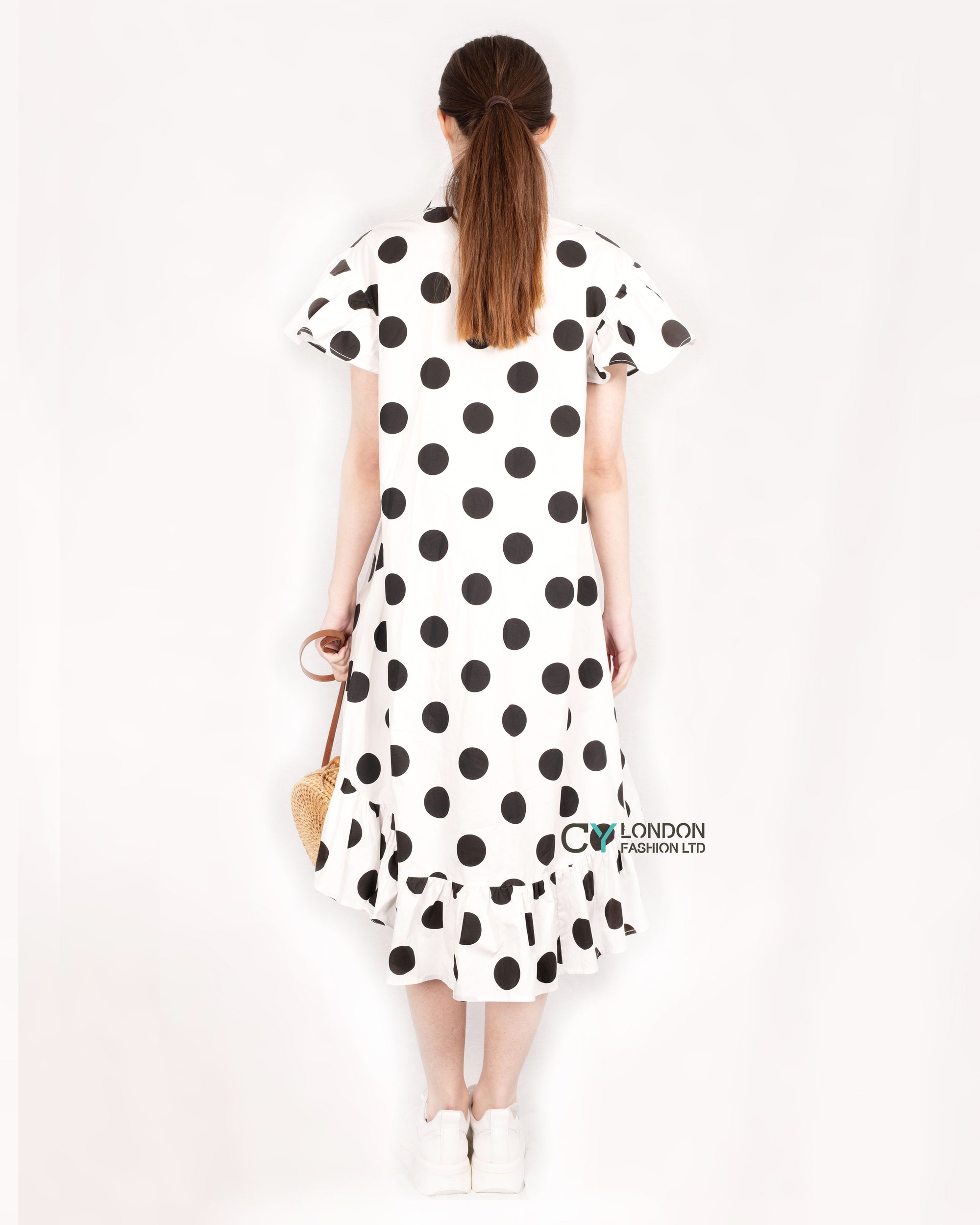 Polka Dot print dip hem dress with frill sleeves design in black white color